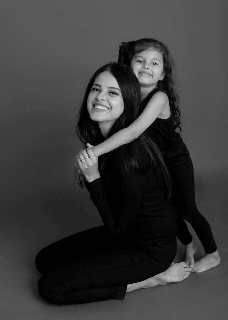 Sobia, founder of So Baby Photography, with her baby in her Karachi studio
